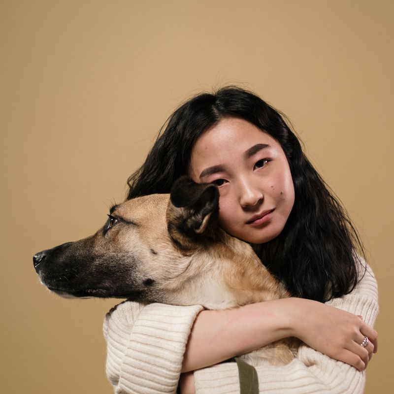 girl holding pet sad