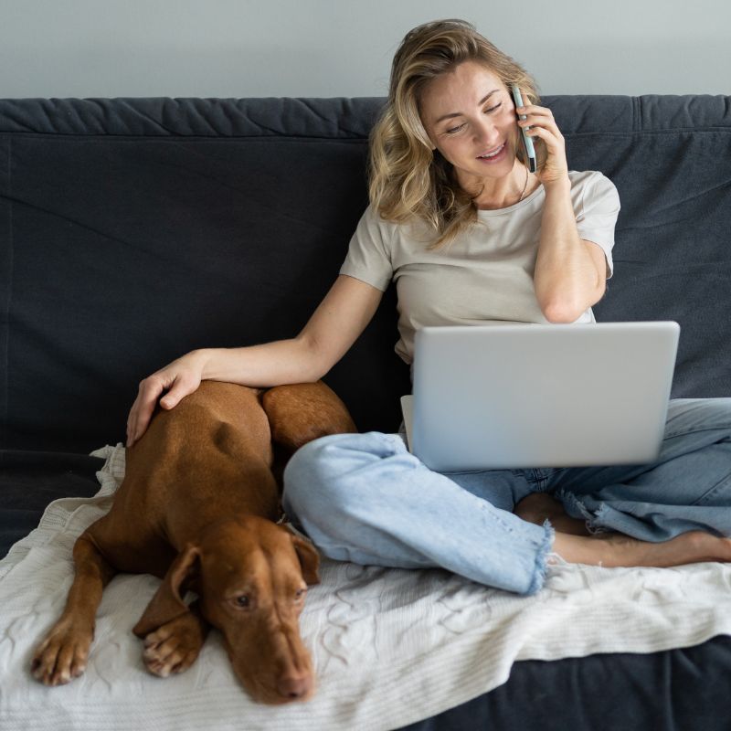 girl on a phone call with pet
